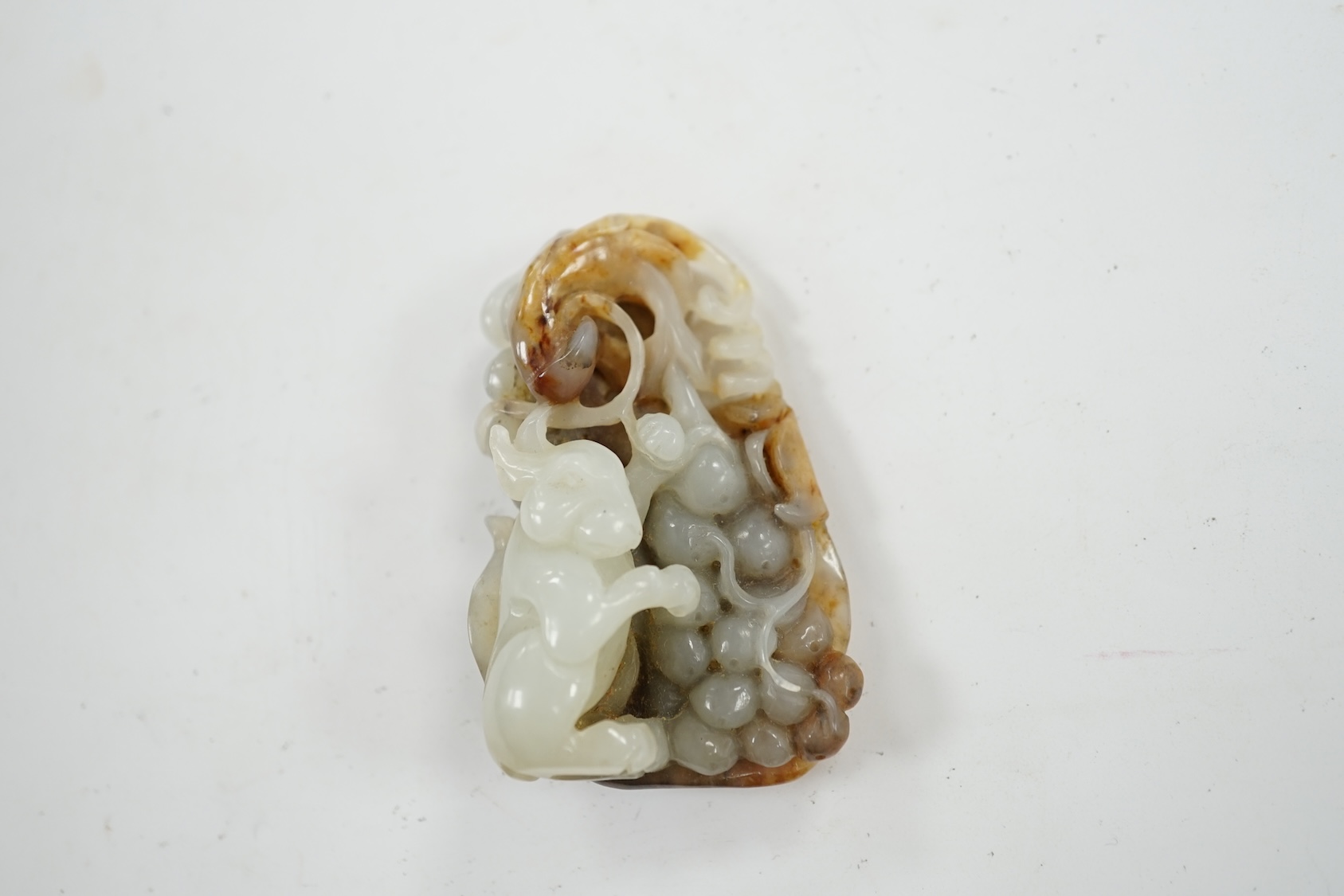 A Chinese russet jade carving of an animal, 6cm high. Condition - good